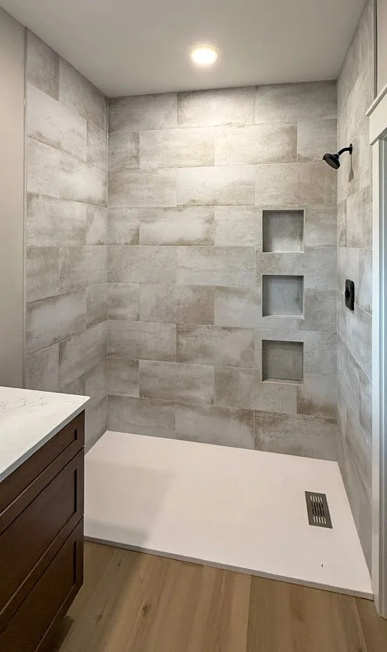 Shower with three stacked niches, each waterproofed before tile
